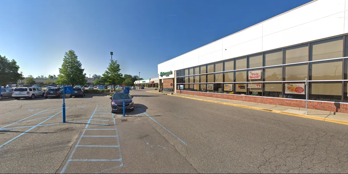 Hollywood Market grocery-anchored retail centre in Metro Detroit, a single-storey neighbourhood centre with a covered walkway and surface parking