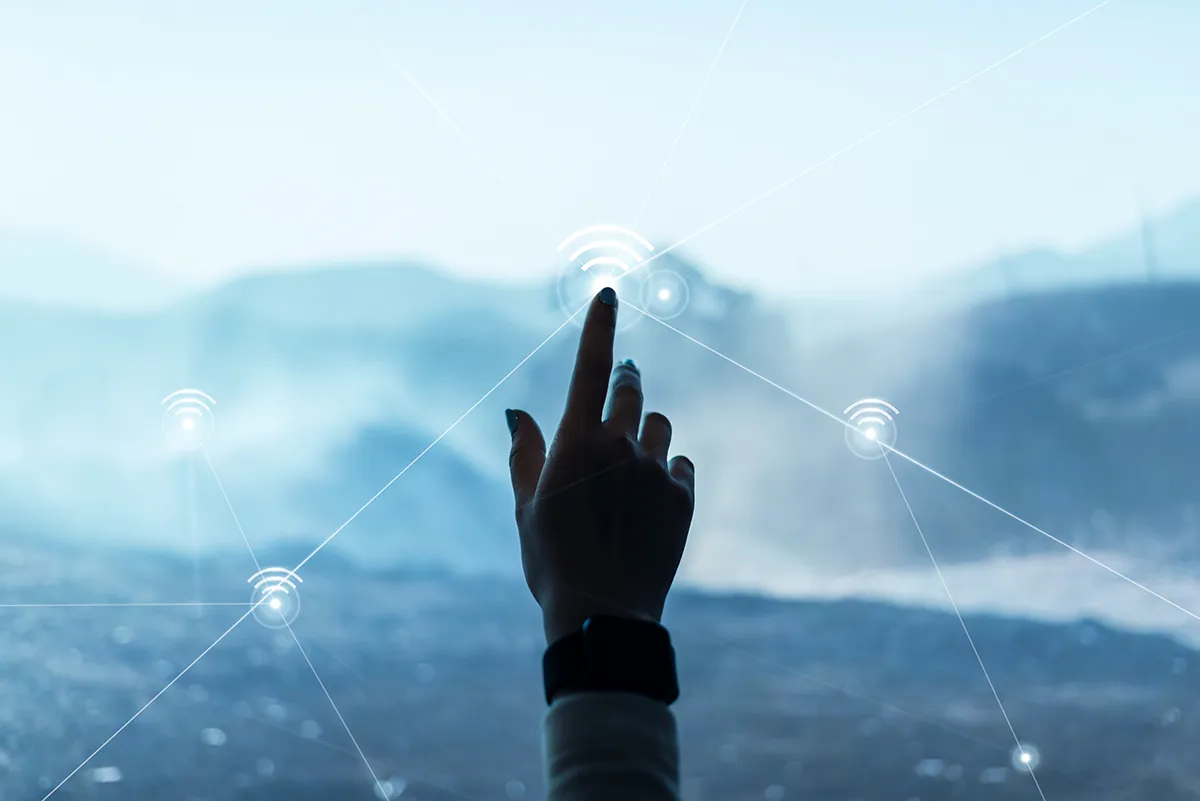 Hand touching a connected network graphic